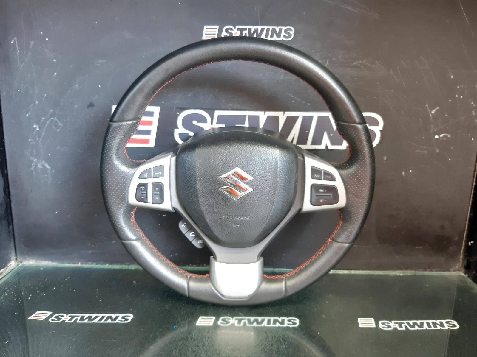 Used auto part listing image: 2016 SUZUKI SWIFT STEERING WHEEL W/ AUDIO AND W/ CRUISE CONTROL TYPE, FZ, 08/10-03/17 0000356864