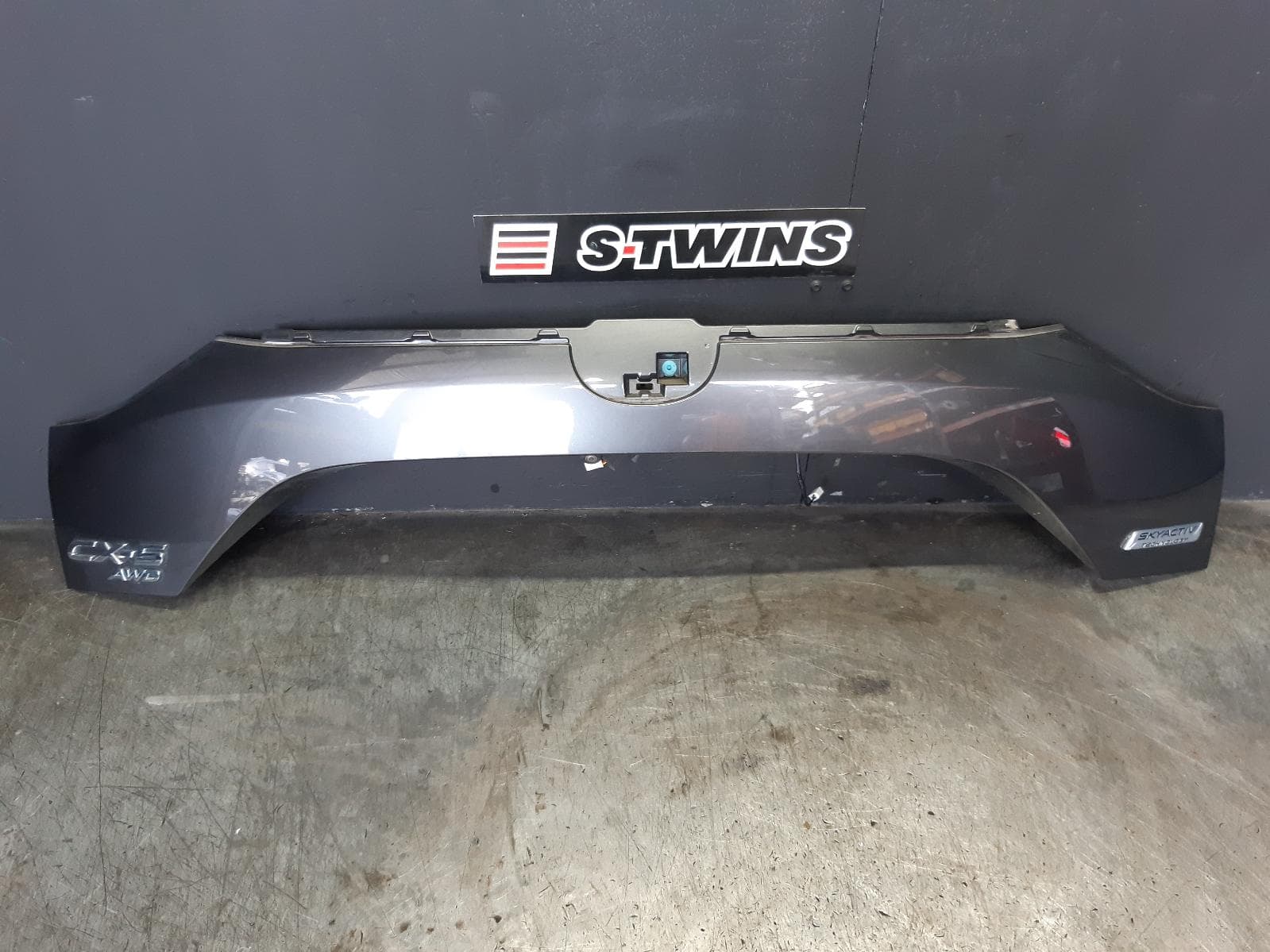 Used auto part listing image: 2019 MAZDA CX5 REAR GARNISH TAILGATE GARNISH (CENTRE LOWER), KF, 02/17-08/21 0000357159