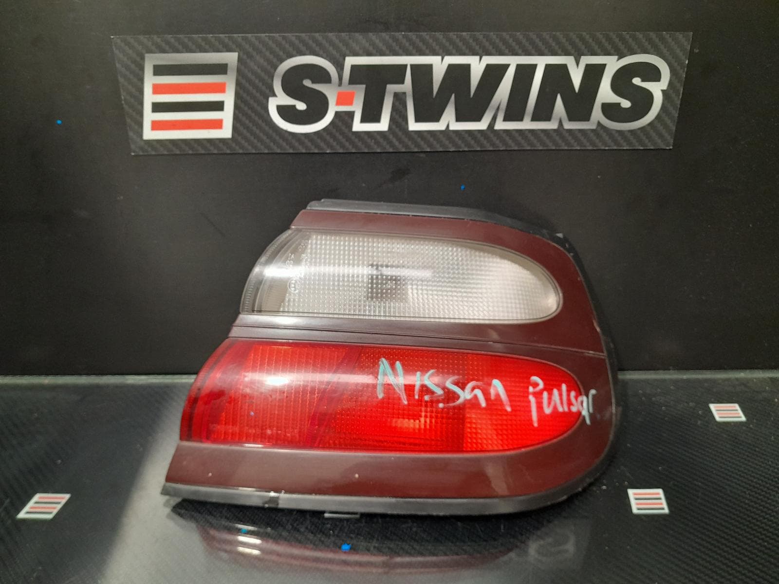 Used auto part listing image: 2000 NISSAN PULSAR RIGHT TAILLIGHT N15, HATCH, ICHIKOH LENS# 7446, 03/98-06/00 0000168446