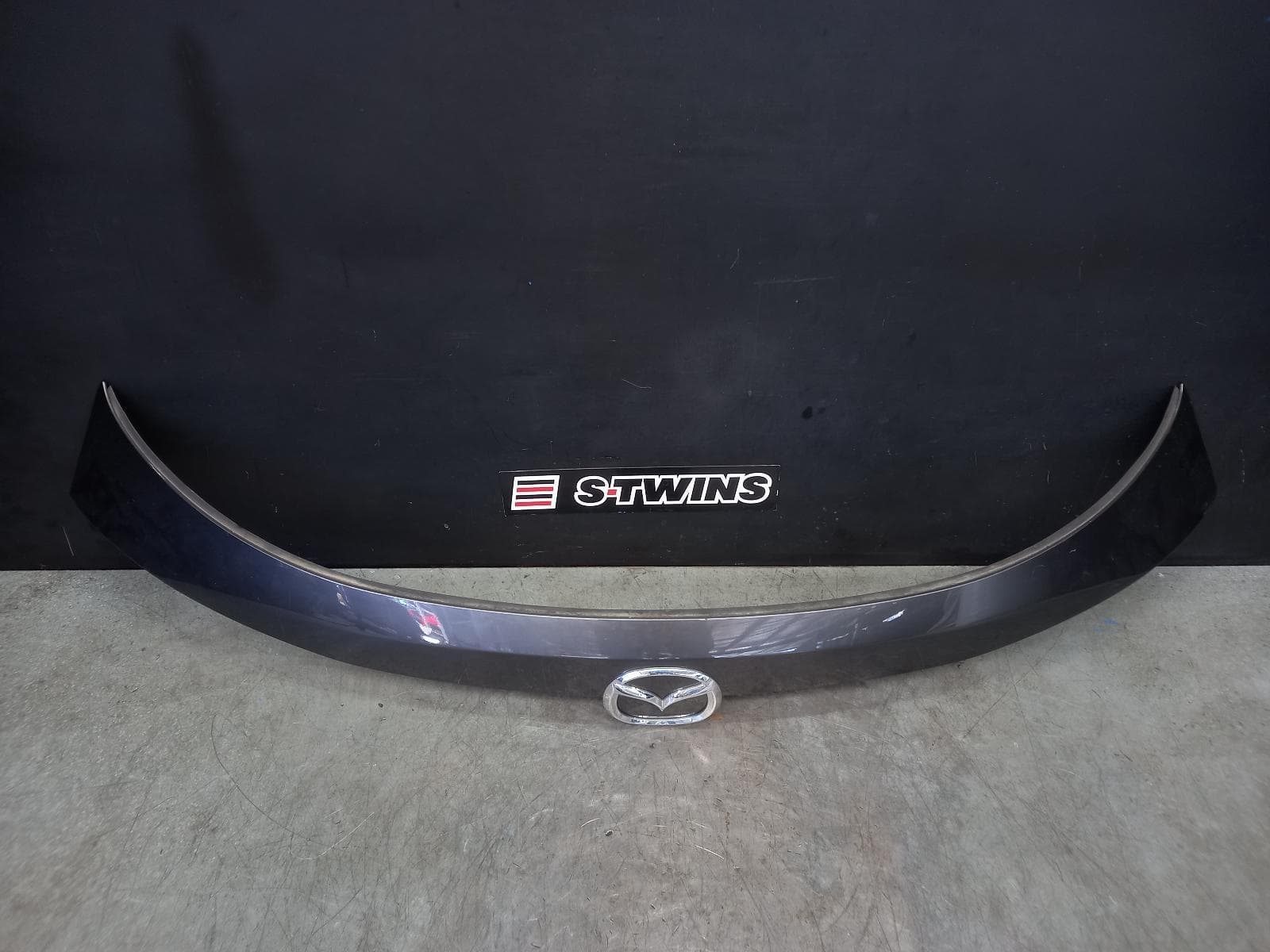 Used auto part listing image: 2023 MAZDA CX5 REAR GARNISH TAILGATE GARNISH (CENTRE UPPER), KF, 09/21- 0000323399