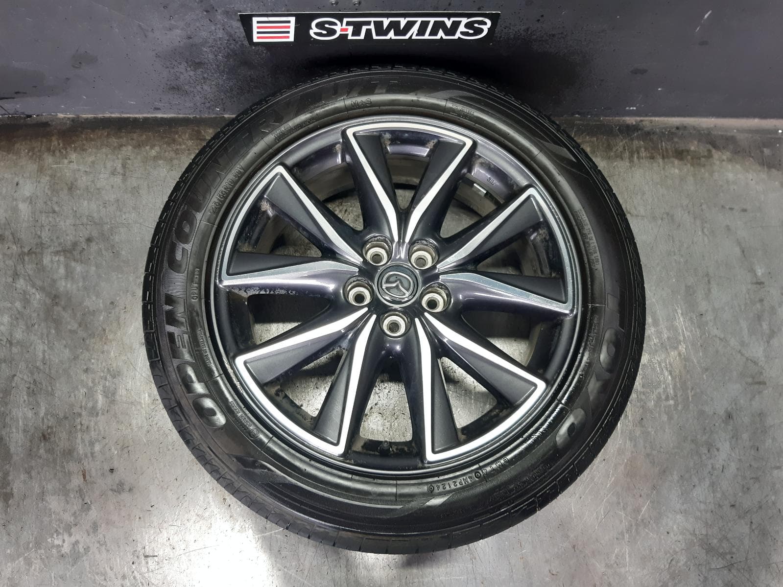 Used auto part listing image: 2017 MAZDA CX5 WHEEL MAG FACTORY, 19X7IN, 5 TWIN SPOKE, BI-COLOUR, KF, 02/17-08/21 0000364578