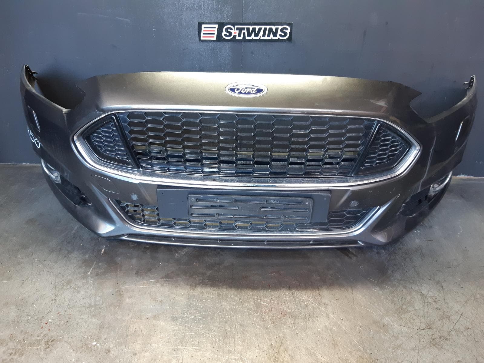 Used auto part listing image: 2015 FORD MONDEO FRONT BUMPER MD, TITANIUM, W/ PARK ASSIST & H/LAMP WASHER TYPE, 09/14-06/20 0000366571