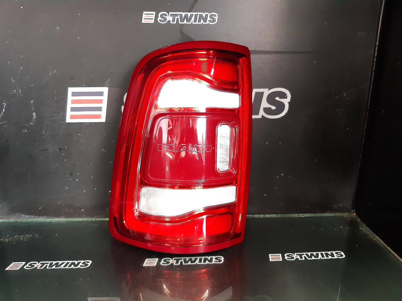 Used auto part listing image: 2022 RAM 1500 LEFT TAILLIGHT DT, LED TYPE, NON SMOKED LENS TYPE, 10/20- 0000314826