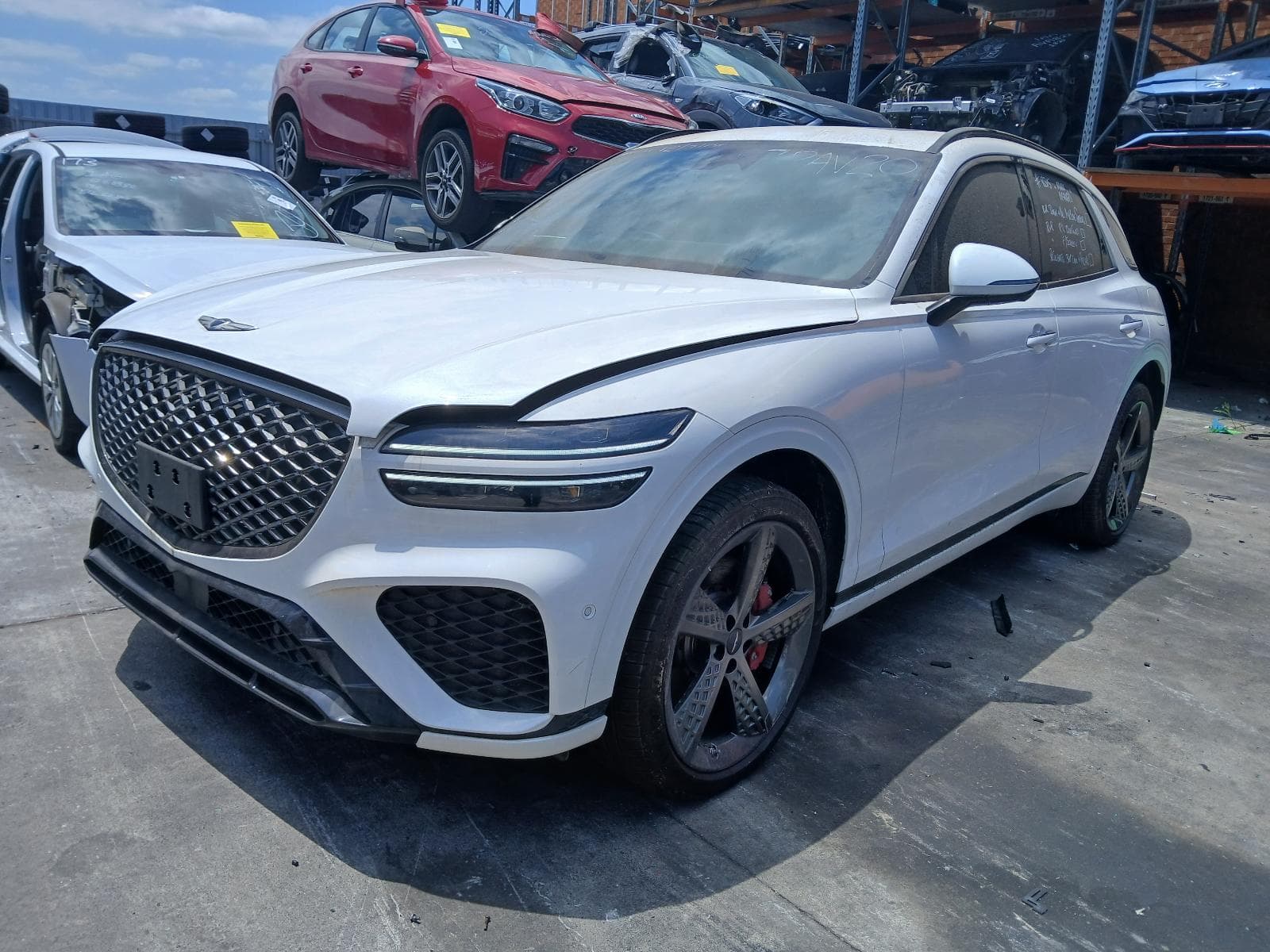 Featured wrecking vehicle: 2023 GENESIS GV70 (stock 9709)