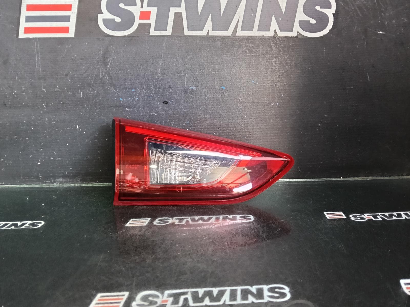 Used auto part listing image: 2016 MAZDA CX3 REAR GARNISH TAILGATE LAMP (LH SIDE), LED TYPE, DK, 03/15-05/18 0000382377