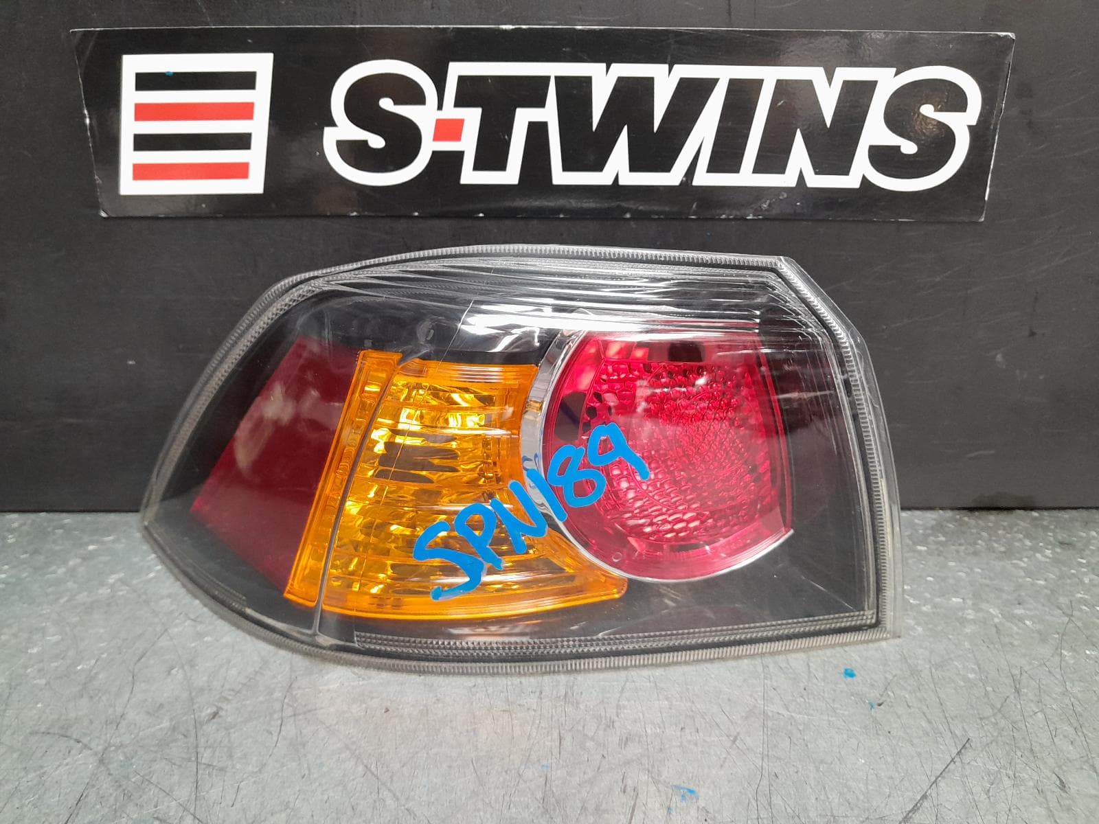 Used auto part listing image: 2011 MITSUBISHI LANCER LEFT TAILLIGHT CJ-CF, SEDAN, BLACK INSERT TYPE, 07/07-12/17 0000375093