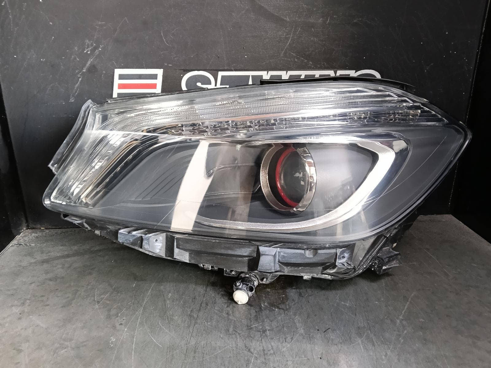 Used auto part listing image: 2014 MERCEDES A CLASS LEFT HEADLAMP W176, W/ BI-XENON, RED RING TYPE, A250, 09/12-08/15 0000377910