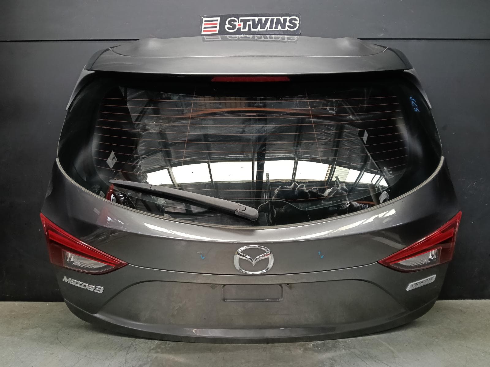 Used auto part listing image: 2018 MAZDA 3 BOOTLID TAILGATE TAILGATE, BM-BN, W/ REVERSE CAMERA, 11/13-02/19 0000398522