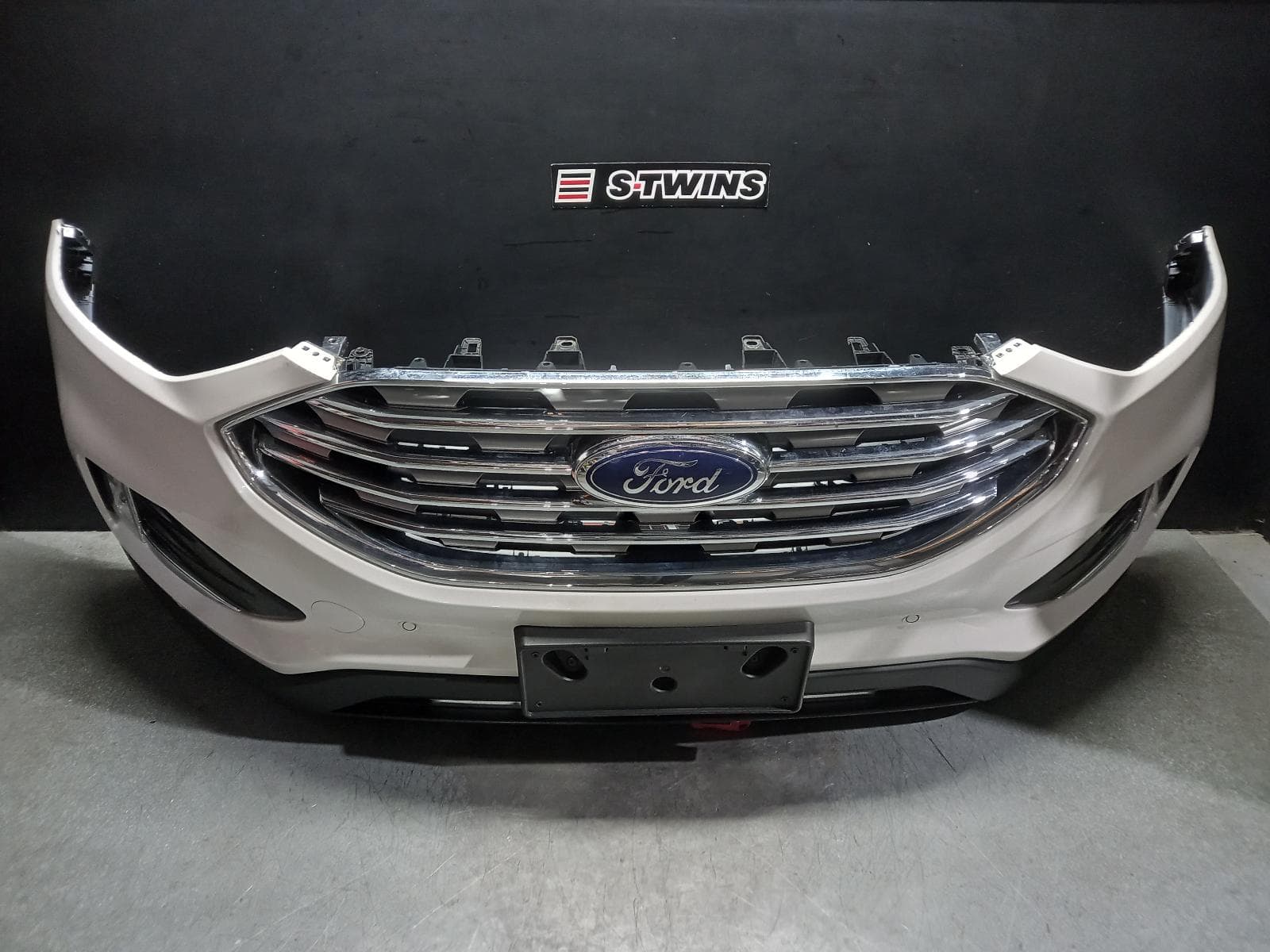 Used auto part listing image: 2019 FORD ENDURA FRONT BUMPER CA, TREND/ST-LINE, W/ PARK SENSOR TYPE, 09/18-06/20 0000399600