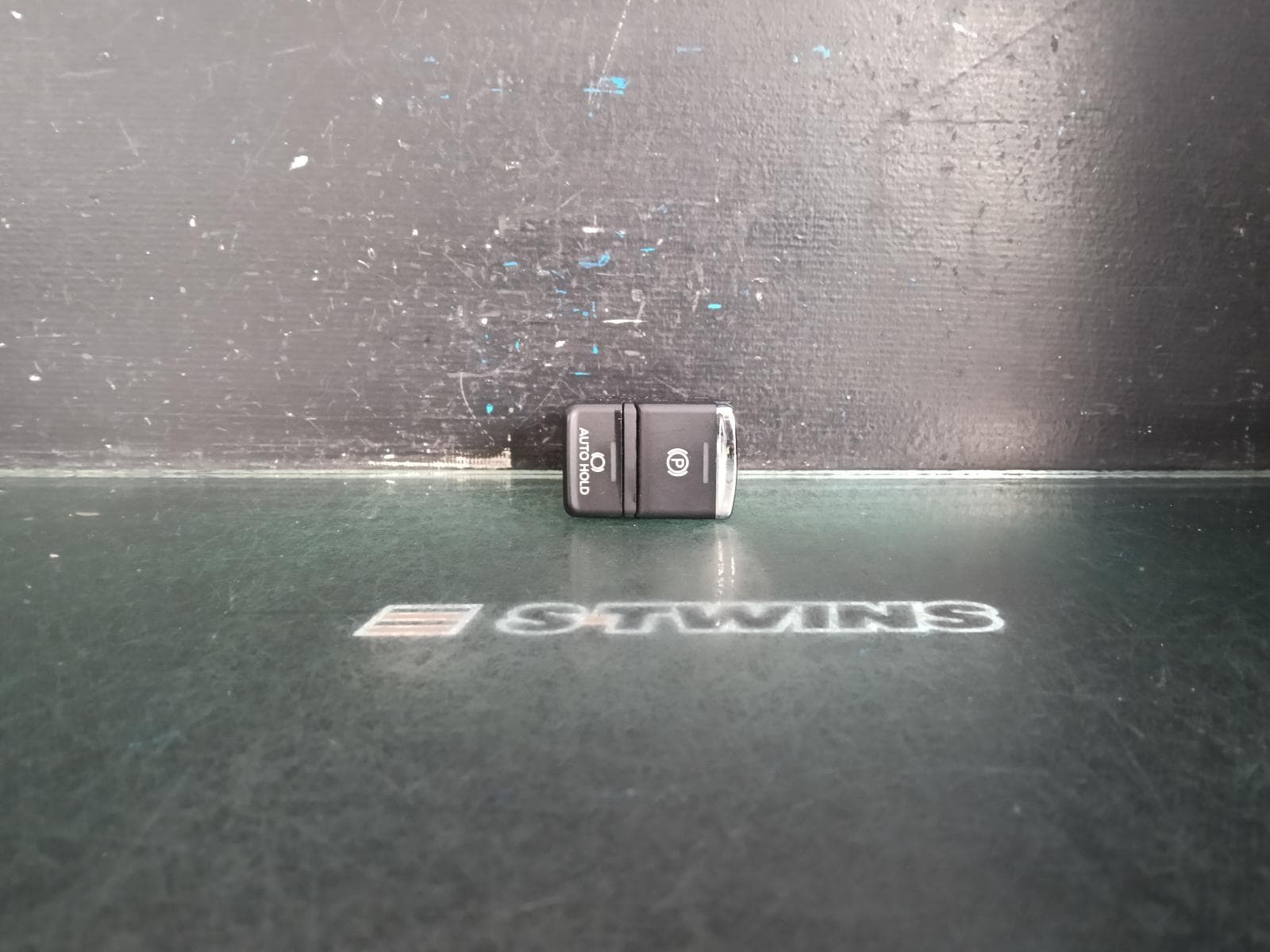 Used auto part listing image: 2018 MITSUBISHI OUTLANDER ELECTRIC PARK BRAKE SWITCH, ZK-ZL, W/ AUTO HOLD, 01/15-07/21 0000405821