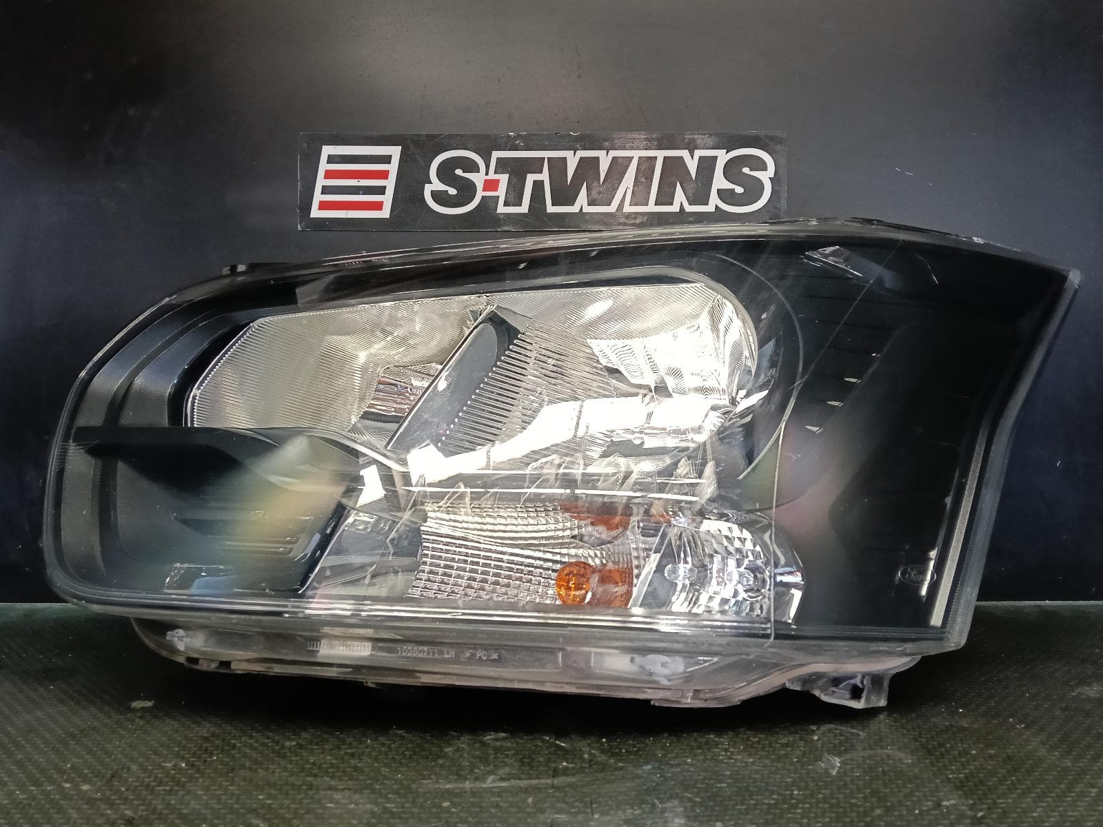 Used auto part listing image: 2024 FORD TRANSIT LEFT HEADLAMP VO, W/ HALOGEN TYPE, W/ BLACK INSERT, 05/16- 0000412506