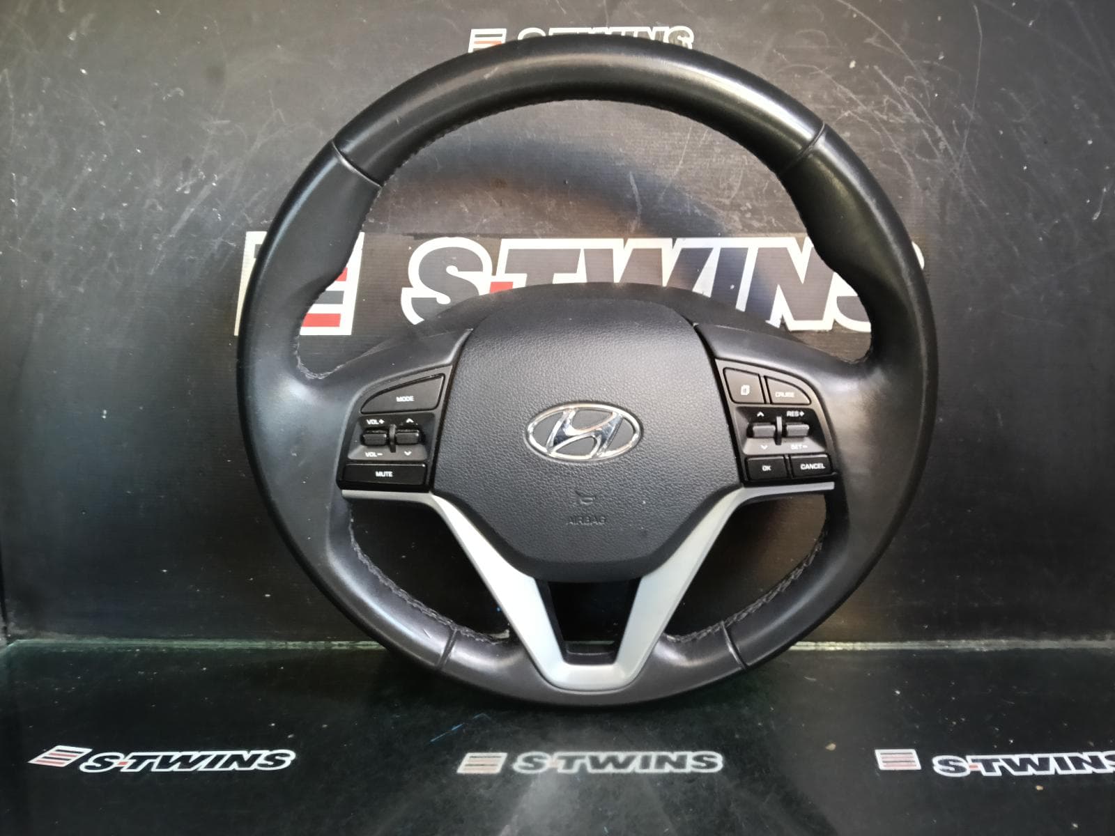 Used auto part listing image: 2015 HYUNDAI TUCSON STEERING WHEEL VINYL, TL, W/CRUISE CONTROL, NON PHONE CONTROL TYPE, 06/15-08/18 0000410450