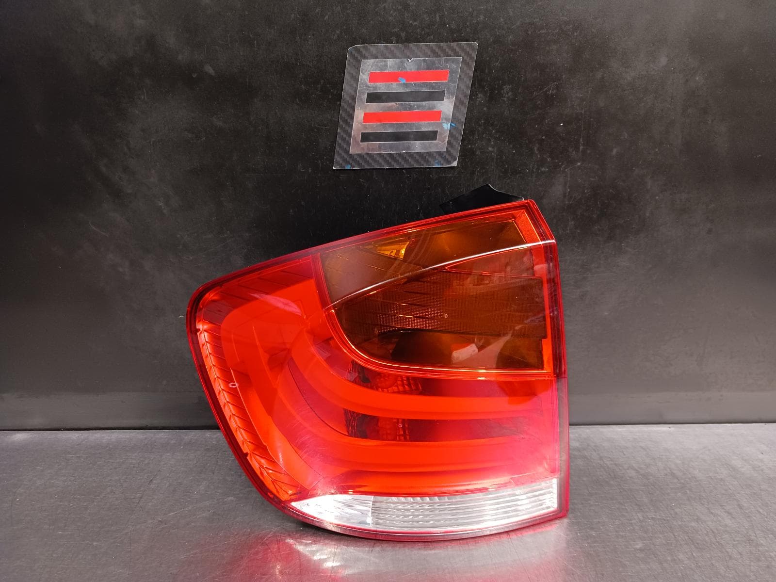 Used auto part listing image: 2010 BMW X1 LEFT TAILLIGHT E84, SINGLE PLUG TYPE, 09/08-07/12 0000239728