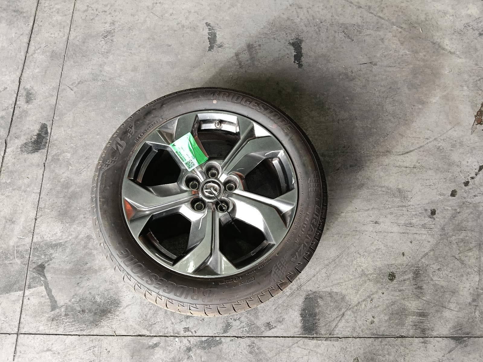 Used auto part listing image: 2022 MAZDA MX30 WHEEL MAG FACTORY, 18X7IN, 5 SPOKE, GREY, DR, 11/20- 0000410708