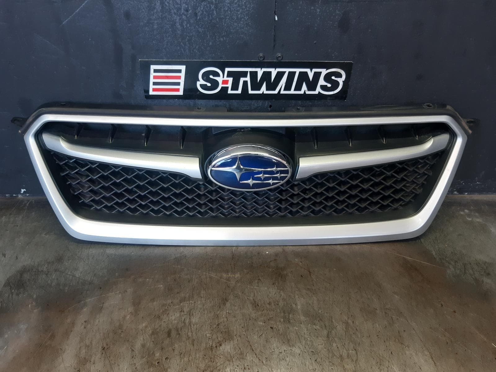 Used auto part listing image: 2015 SUBARU IMPREZA GRILLE RADIATOR GRILLE, G4, HATCH/SEDAN, SILVER SURROUND TYPE, 10/11-09/15 0000375857