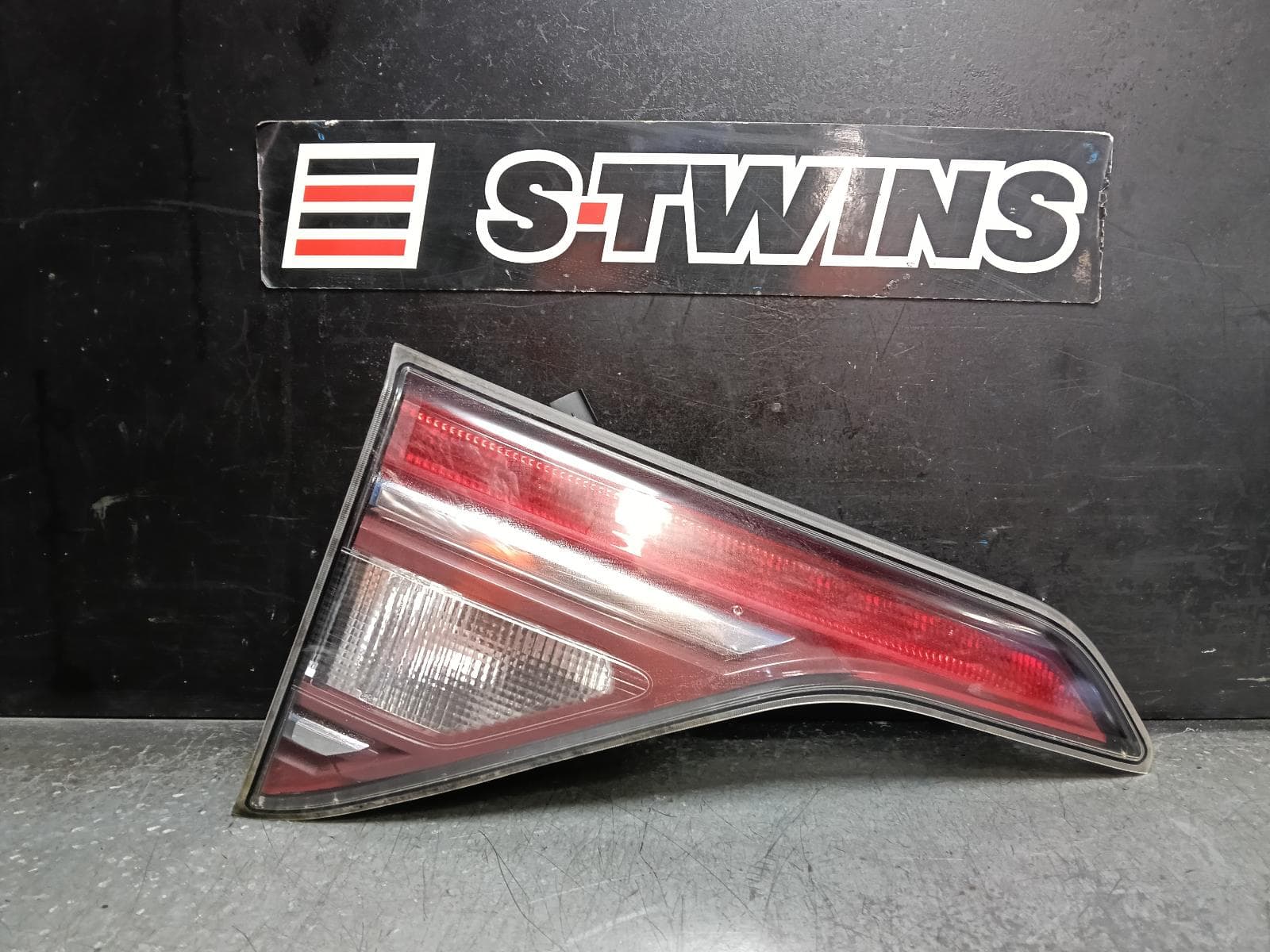 Used auto part listing image: 2018 HOLDEN ACADIA REAR GARNISH AC, TAILGATE LAMP (LH SIDE), LED TYPE, 08/18-07/20 0000415145