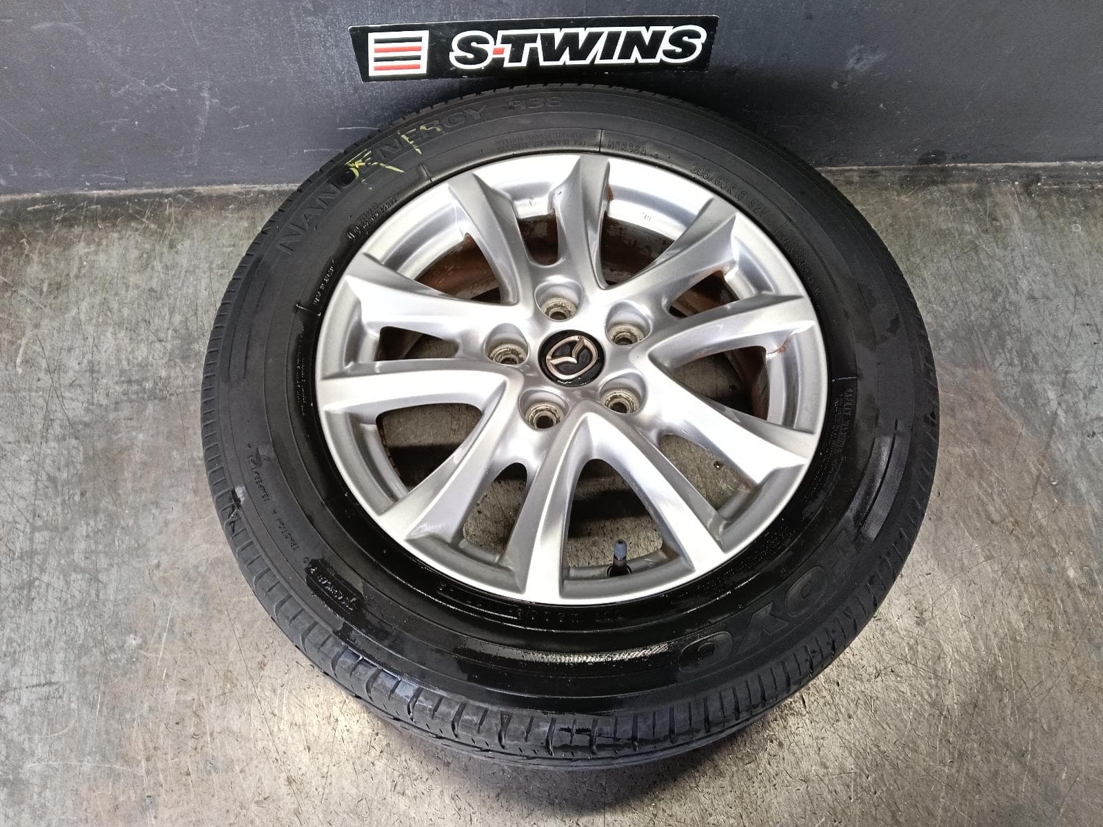 Used auto part listing image: 2014 MAZDA 3 WHEEL MAG FACTORY, 16X6.5IN, BM-BN, MAXX/TOURING, 11/13-02/19 0000415962