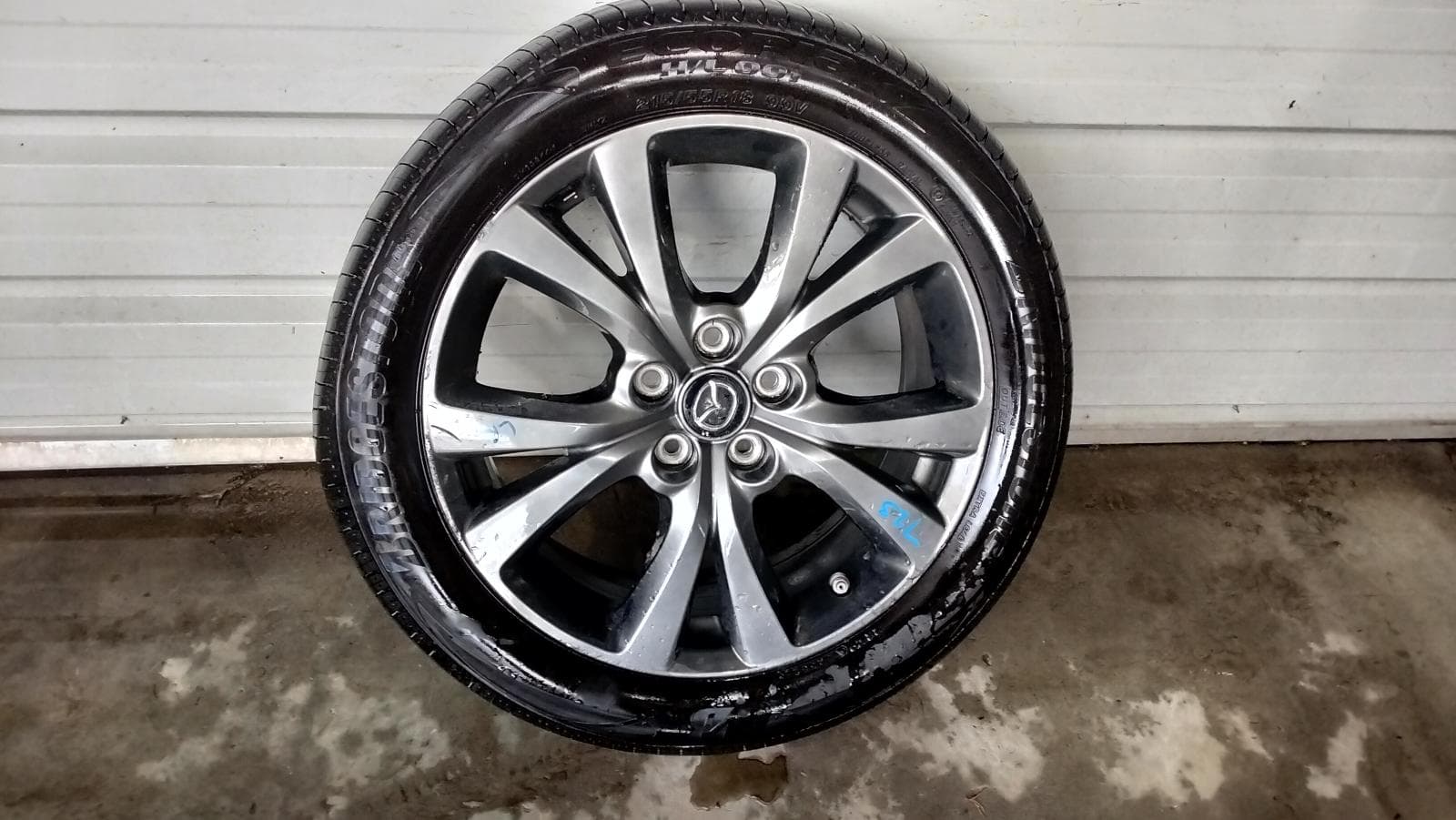 Used auto part listing image: 2022 MAZDA CX30 WHEEL MAG FACTORY, 18X7IN, 5 V SPOKE, DARK GREY, DM, 10/19- 0000416543