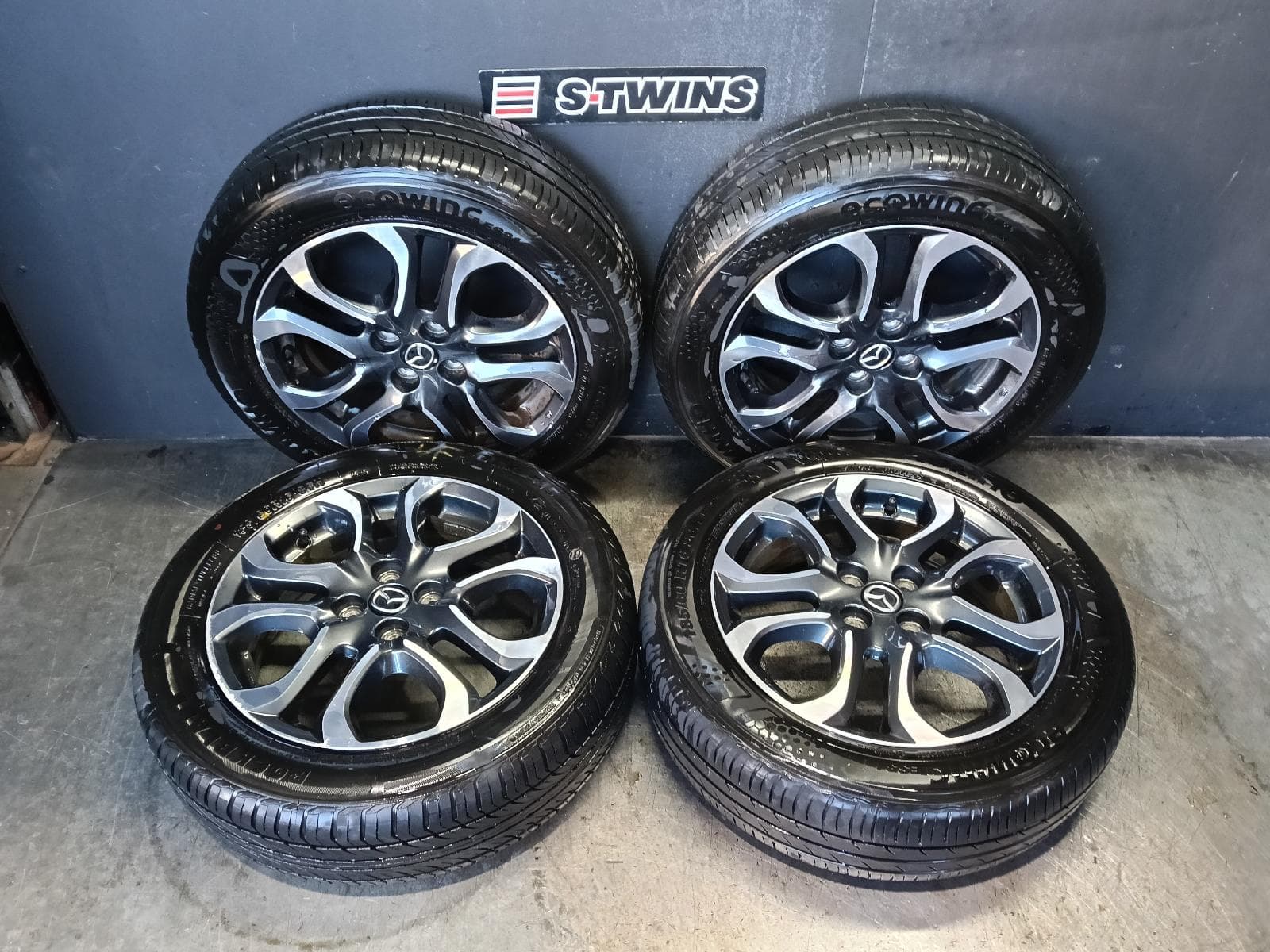 Used auto part listing image: 2019 MAZDA 2 WHEEL MAG FACTORY, 16X5.5IN, 5 U SPOKE, GREY, DJ/DL, 09/14-10/19 0000421742