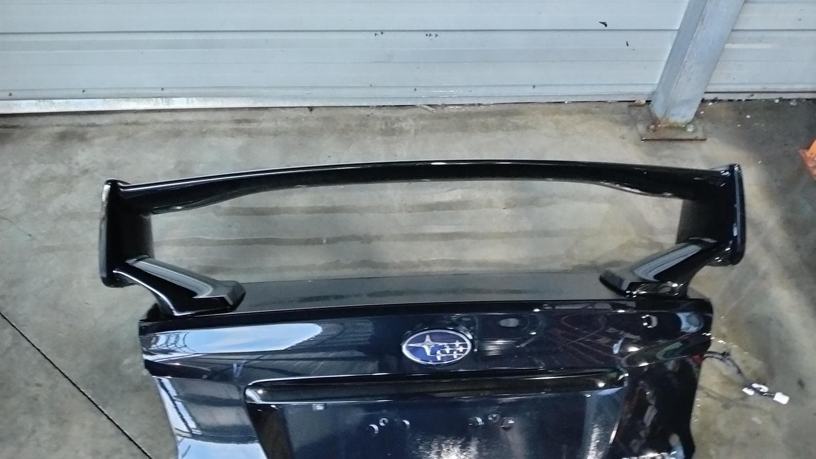 Used auto part listing image: 2017 SUBARU WRX BOOTLID TAILGATE BOOTLID, V1, STi, 2 POST SPOILER TYPE, 03/14-10/21 0000422189