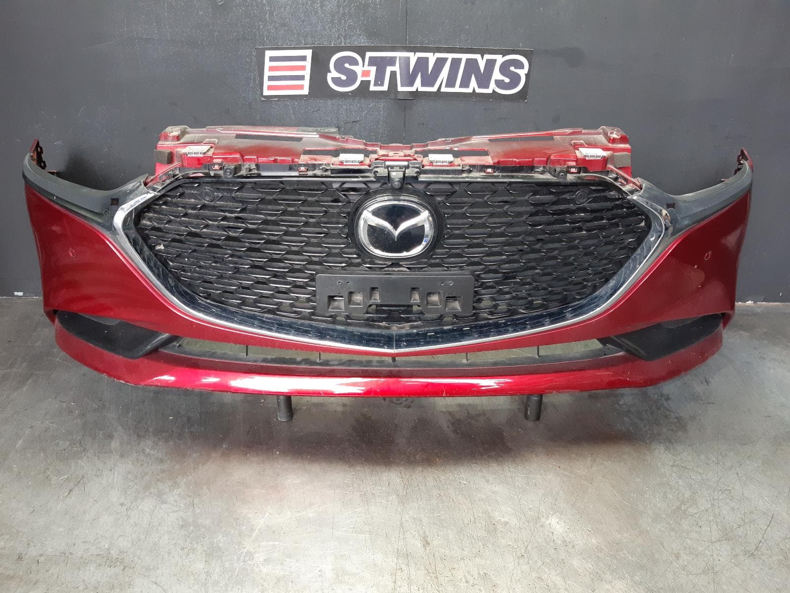 Used auto part listing image: 2022 MAZDA 3 FRONT BUMPER BP, SEDAN, BUMPER BAR, W/ PARK SENSOR TYPE, 03/19- 0000337842