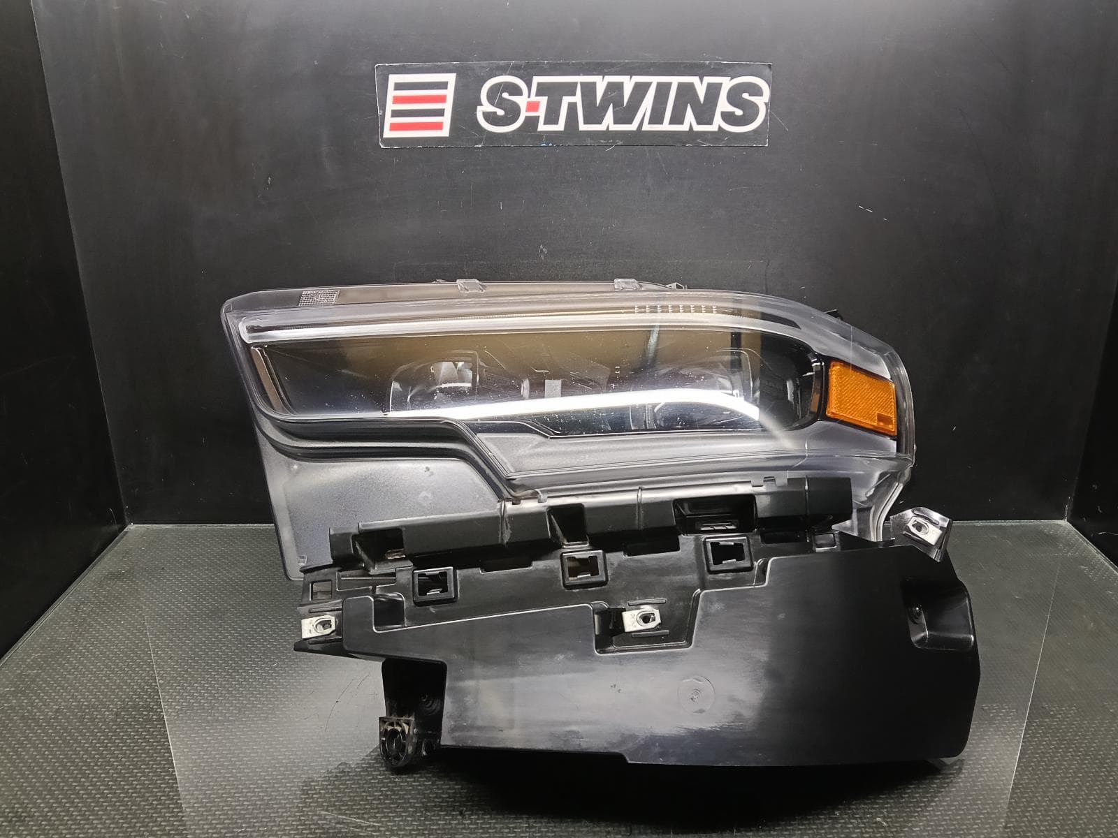 Used auto part listing image: 2022 RAM 1500 LEFT HEADLAMP DT, W/ LED, PROJECTOR, DAYTIME RUNNING LAMP TYPE, 10/20-12/23 0000424196