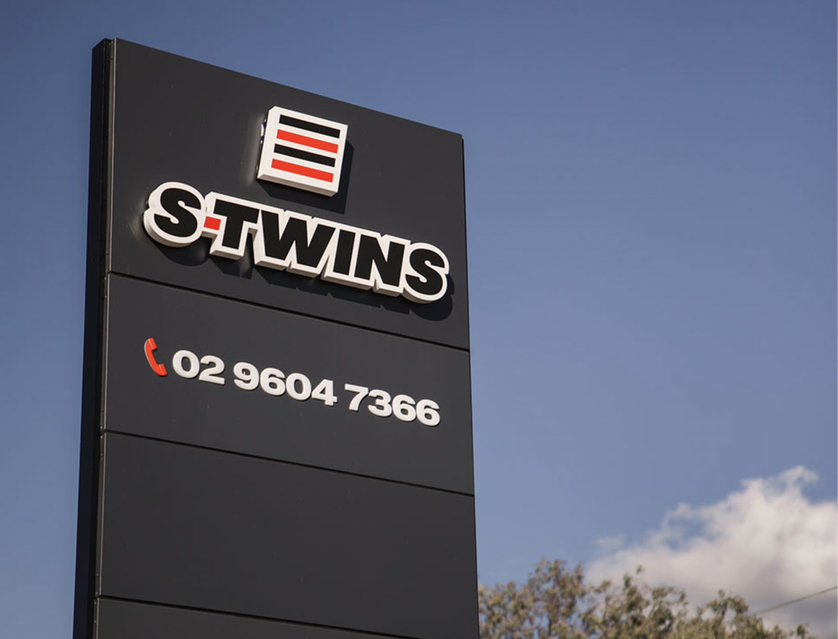 S-TWINS signage with phone number